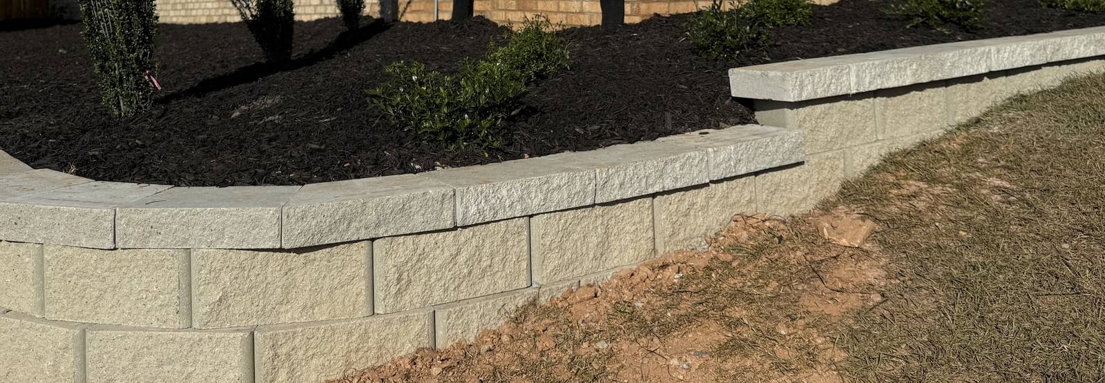 Stone border edging a garden bed