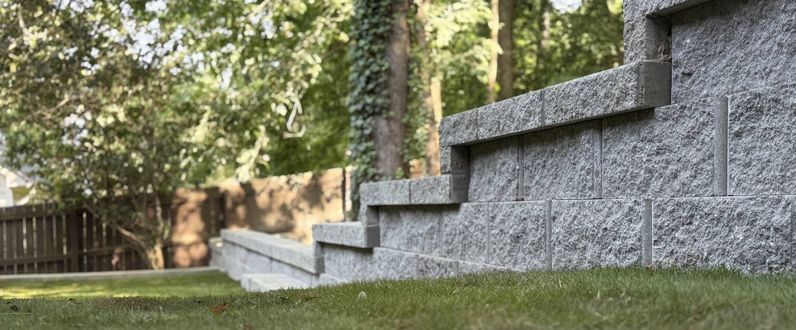 Block steps in sloped landscaping with greenery